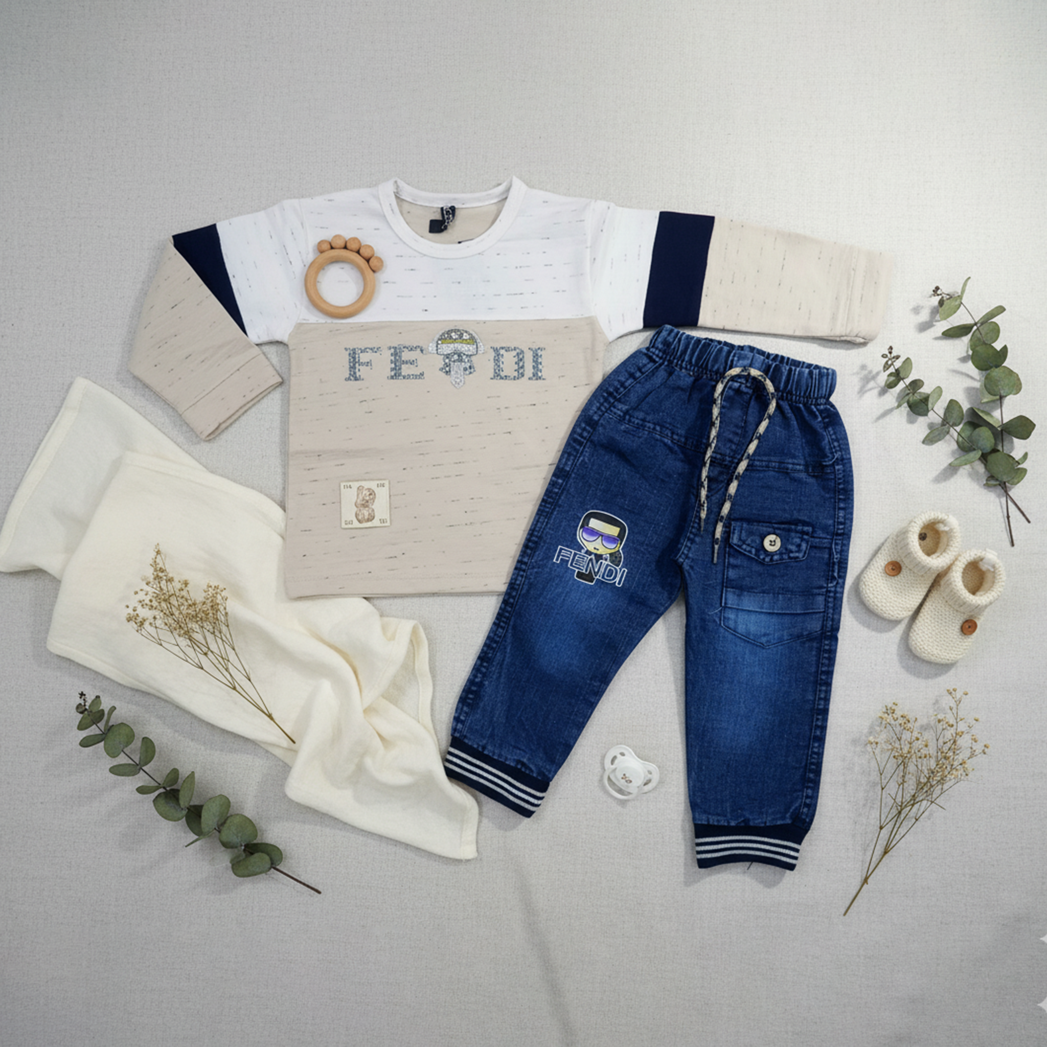 Child wearing a beige shirt with 'Fendi' branding and blue pants in a room setting.