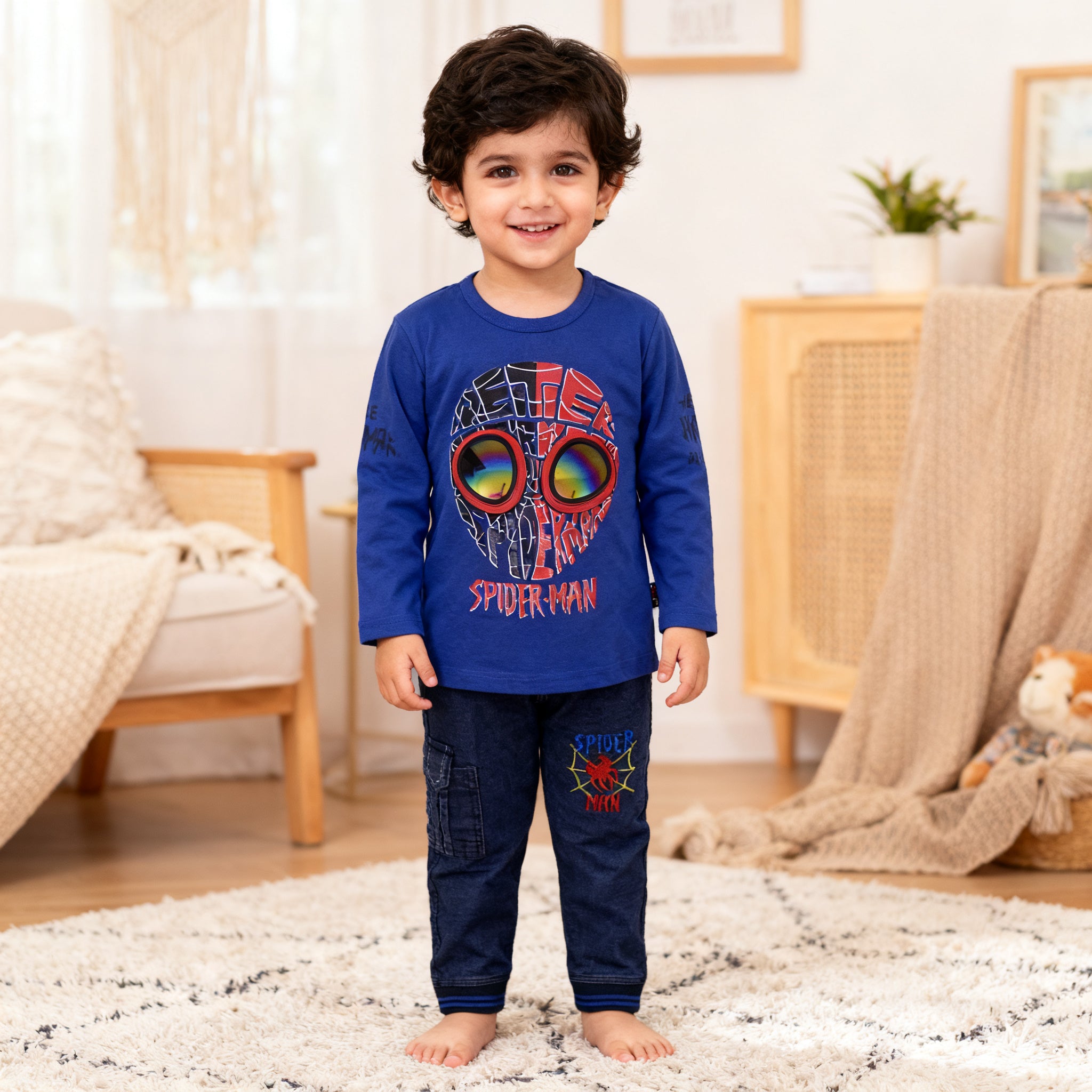 Child wearing Spider-Man pajamas in a cozy living room